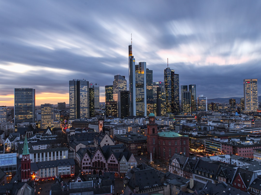Photo by Matthias Münning city skyline under white clouds during daytime